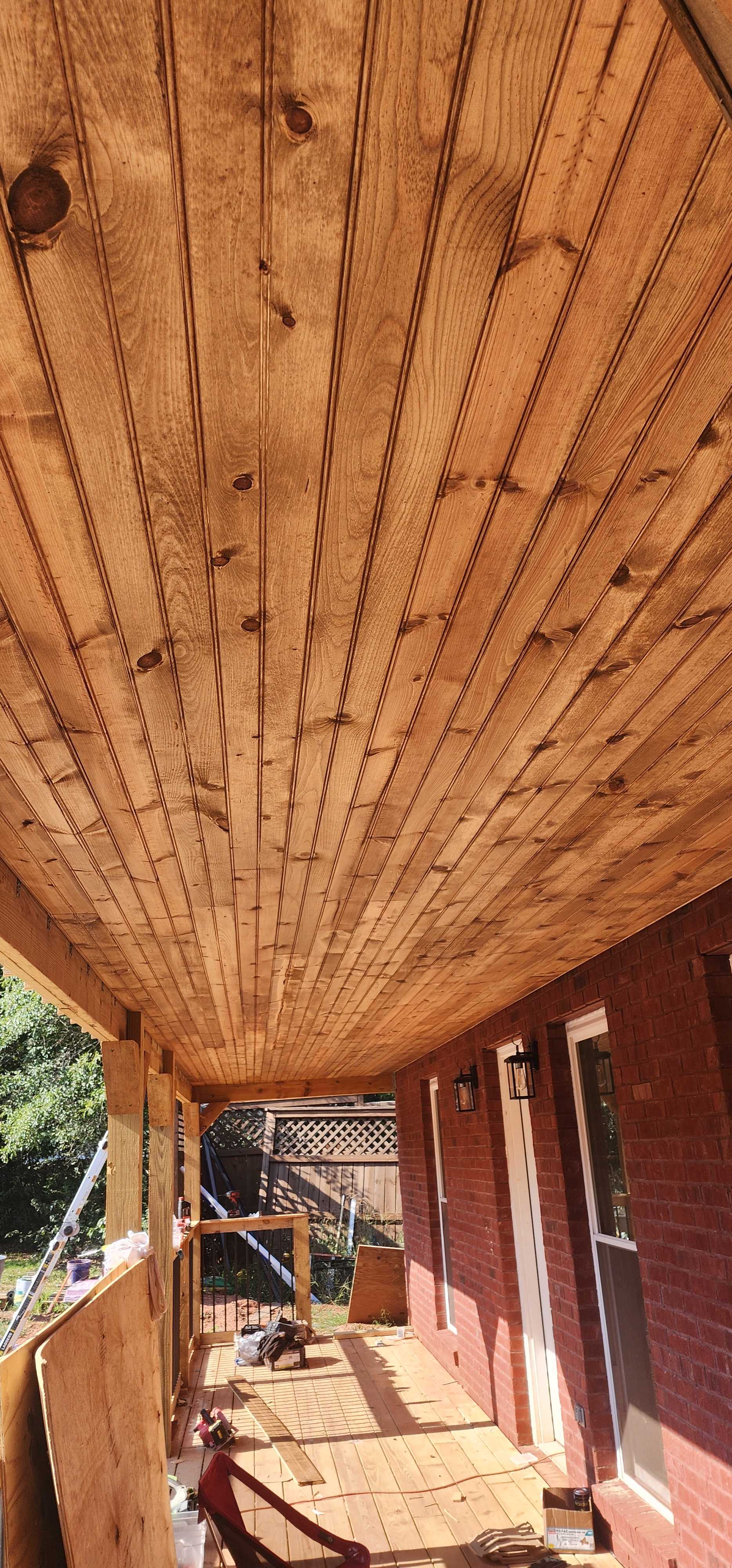 Stained tongue-and-groove porch ceiling